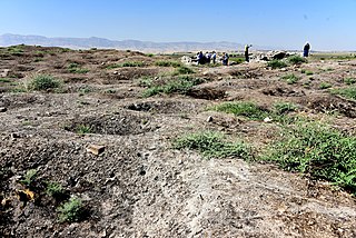 Multiple holes left by looters in the Shahrizor plain, Iraq